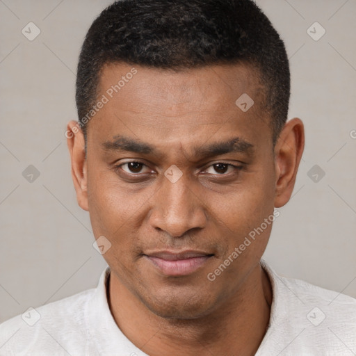 Joyful black young-adult male with short  brown hair and brown eyes