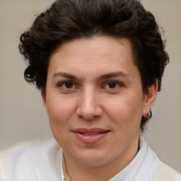 Joyful white adult female with short  brown hair and brown eyes