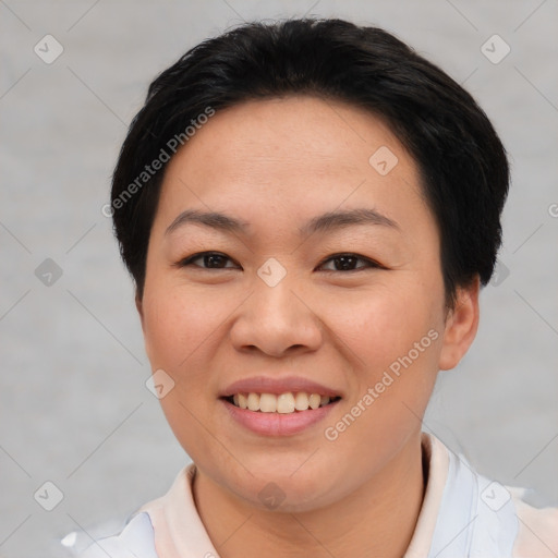 Joyful asian young-adult female with short  brown hair and brown eyes