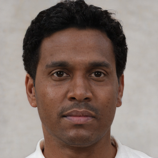 Neutral black young-adult male with short  brown hair and brown eyes