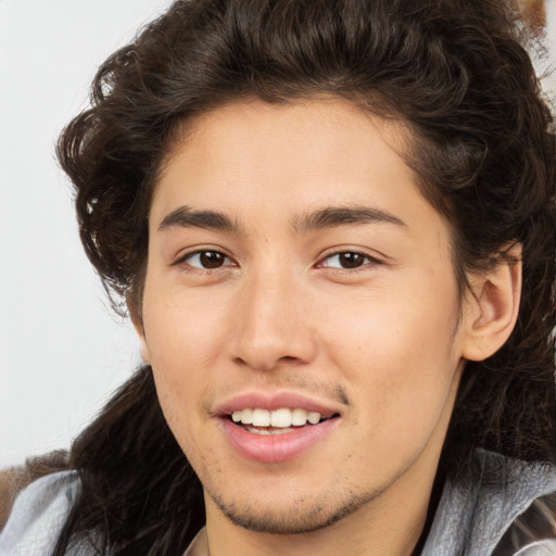 Joyful white young-adult male with medium  brown hair and brown eyes