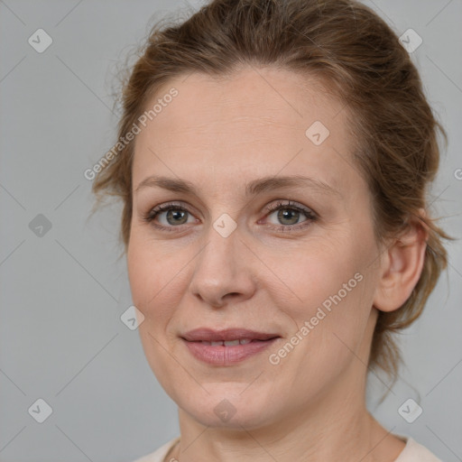 Joyful white adult female with medium  brown hair and brown eyes