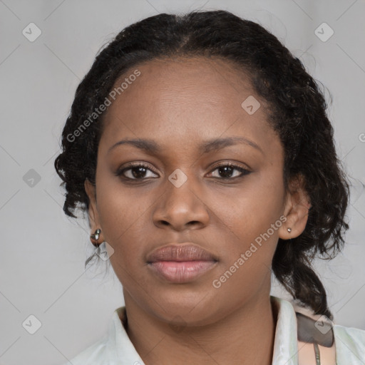 Joyful black young-adult female with medium  black hair and brown eyes