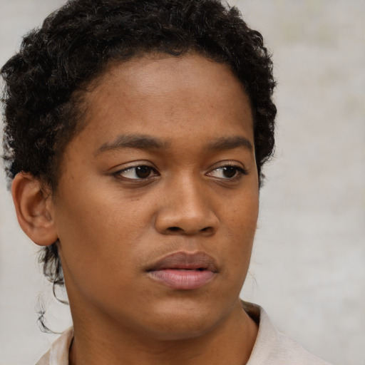 Neutral black young-adult male with short  brown hair and brown eyes