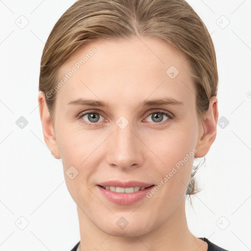 Joyful white young-adult female with medium  brown hair and grey eyes