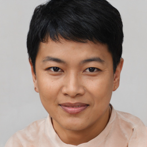 Joyful asian young-adult female with short  black hair and brown eyes