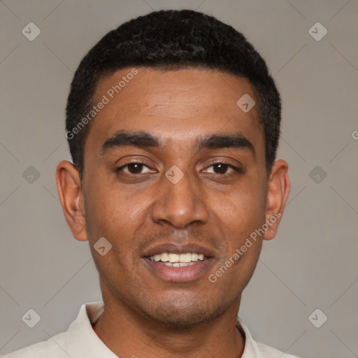 Joyful black young-adult male with short  black hair and brown eyes
