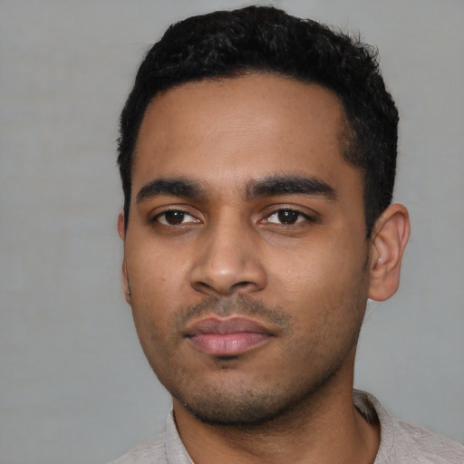 Neutral latino young-adult male with short  black hair and brown eyes