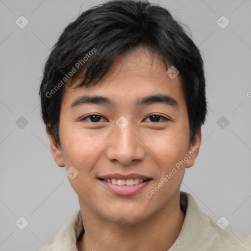 Joyful asian young-adult male with short  black hair and brown eyes