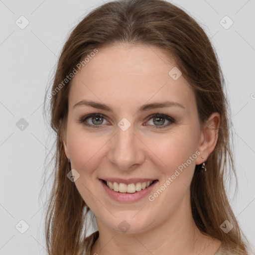 Joyful white young-adult female with long  brown hair and grey eyes