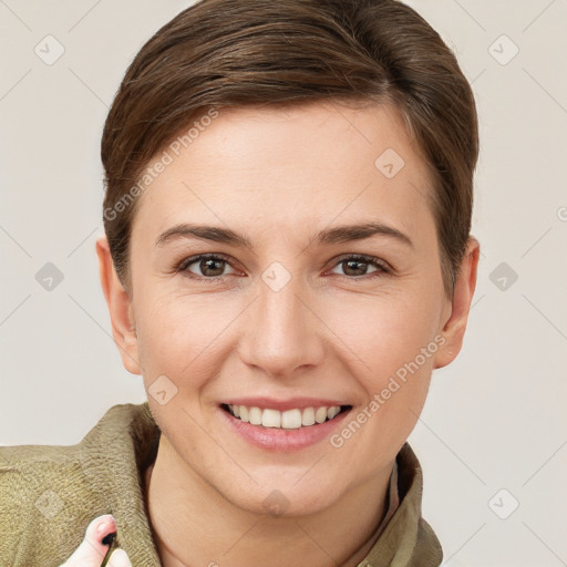 Joyful white young-adult female with short  brown hair and grey eyes