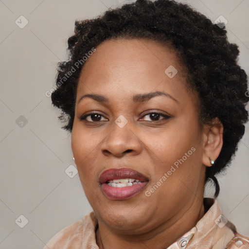 Joyful black adult female with short  brown hair and brown eyes