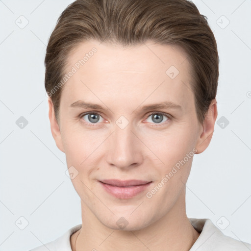 Joyful white young-adult female with short  brown hair and grey eyes