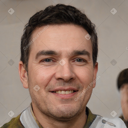 Joyful white adult male with short  brown hair and brown eyes