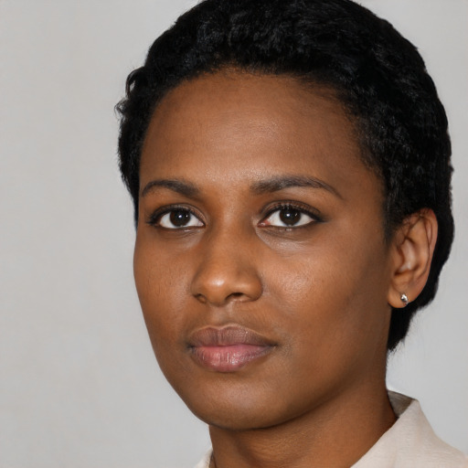 Neutral black young-adult female with short  black hair and brown eyes