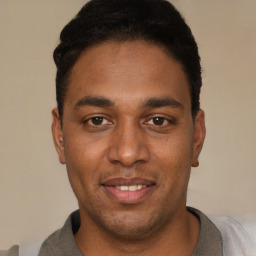 Joyful white young-adult male with short  black hair and brown eyes