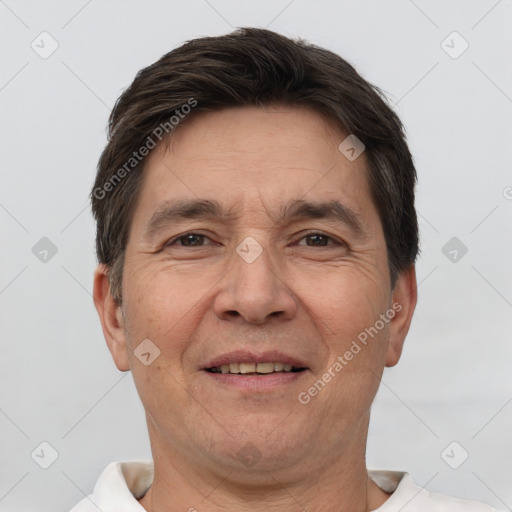 Joyful white adult male with short  brown hair and brown eyes