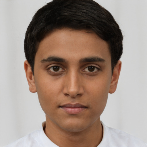 Neutral latino young-adult male with short  brown hair and brown eyes