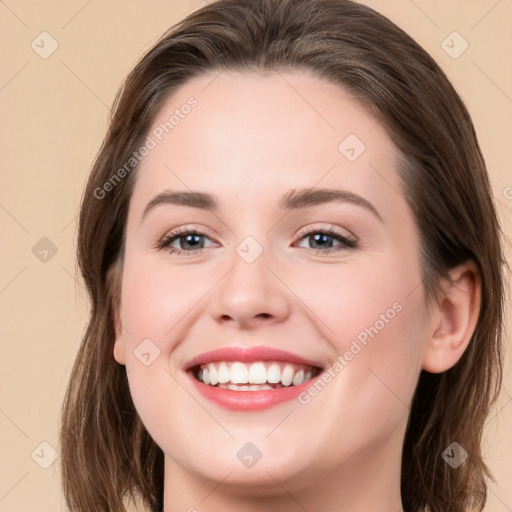 Joyful white young-adult female with long  brown hair and green eyes