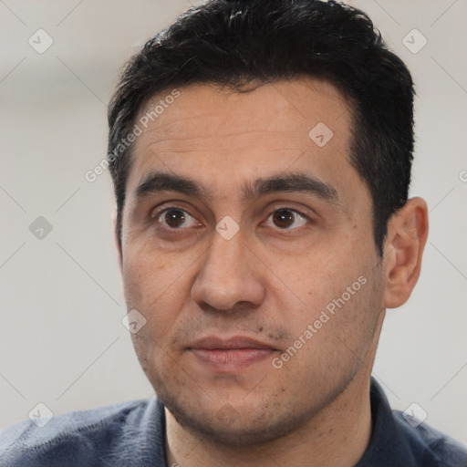 Joyful white young-adult male with short  black hair and brown eyes