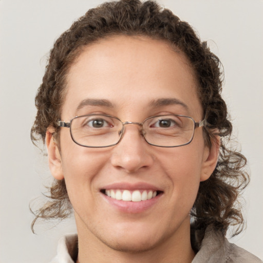 Joyful white adult female with short  brown hair and green eyes