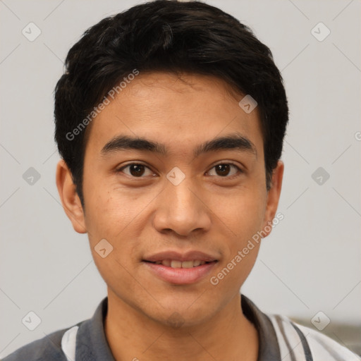 Joyful latino young-adult male with short  black hair and brown eyes