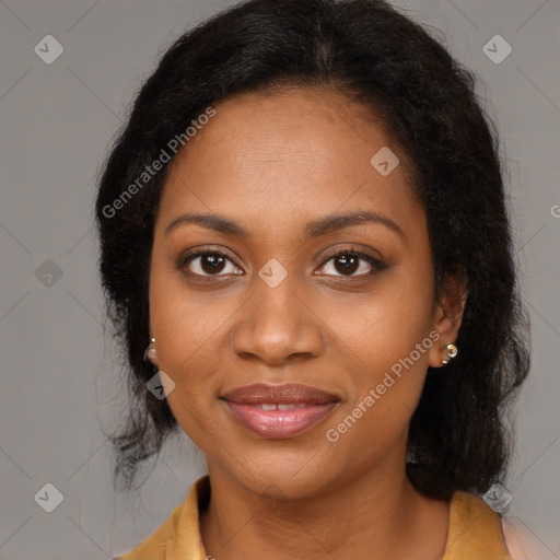 Joyful black young-adult female with medium  brown hair and brown eyes