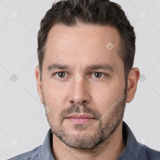 Neutral white adult male with short  brown hair and brown eyes