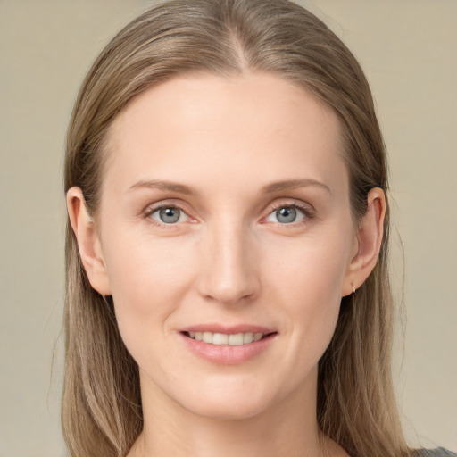 Joyful white young-adult female with long  brown hair and grey eyes