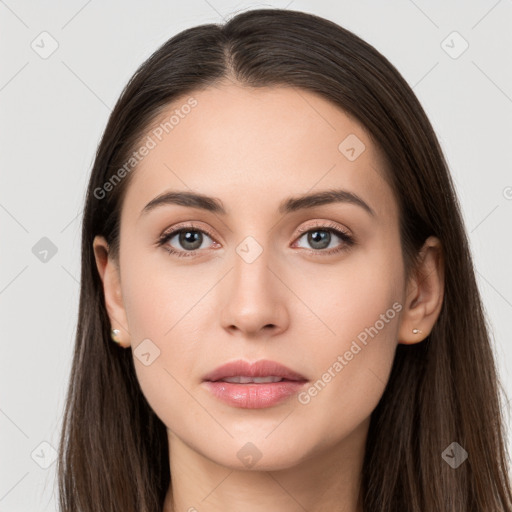 Neutral white young-adult female with long  brown hair and brown eyes