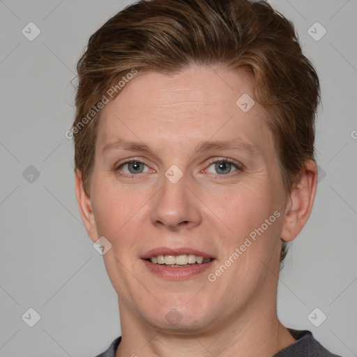 Joyful white adult female with short  brown hair and grey eyes