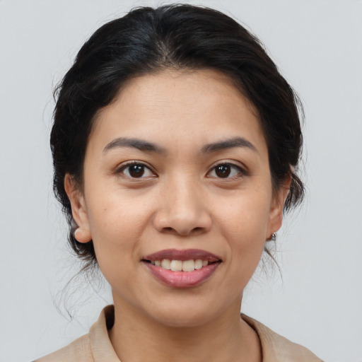 Joyful white young-adult female with medium  brown hair and brown eyes