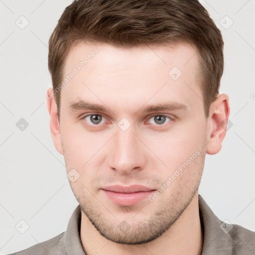 Neutral white young-adult male with short  brown hair and grey eyes