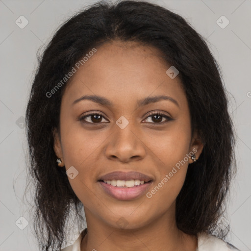 Joyful black young-adult female with long  brown hair and brown eyes