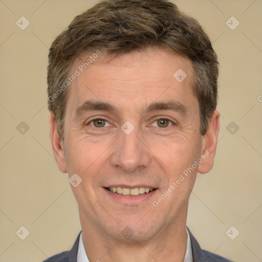 Joyful white adult male with short  brown hair and brown eyes