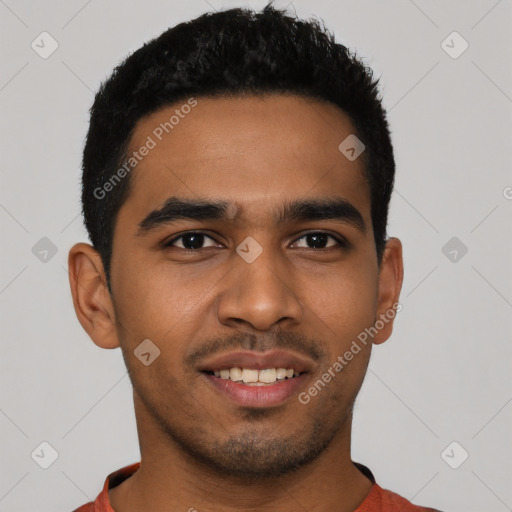 Joyful latino young-adult male with short  black hair and brown eyes