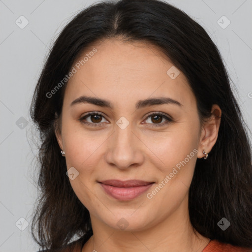 Joyful latino young-adult female with long  brown hair and brown eyes