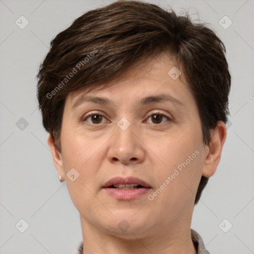 Joyful white adult female with short  brown hair and brown eyes