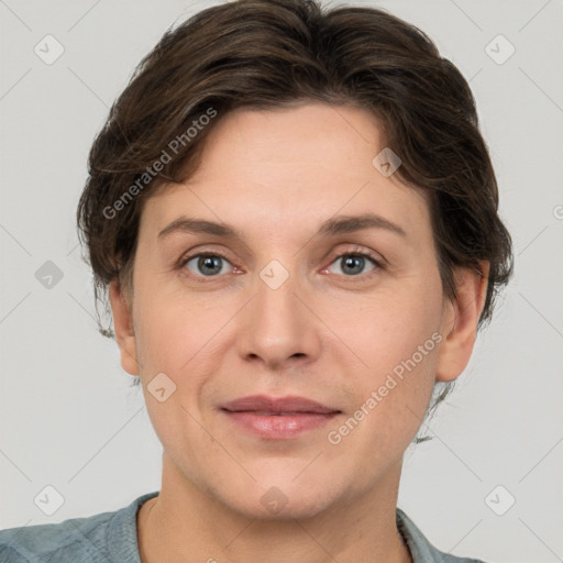 Joyful white adult female with short  brown hair and grey eyes