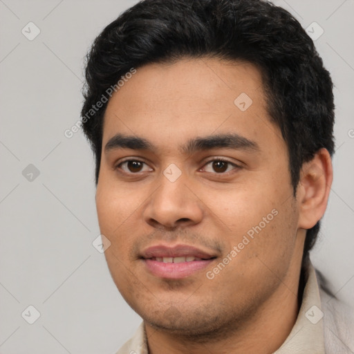 Joyful latino young-adult male with short  black hair and brown eyes