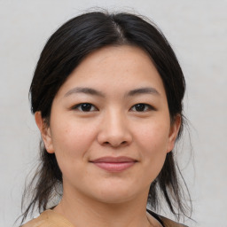 Joyful asian young-adult female with medium  brown hair and brown eyes