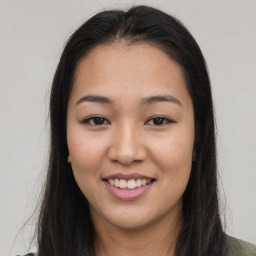 Joyful asian young-adult female with long  brown hair and brown eyes