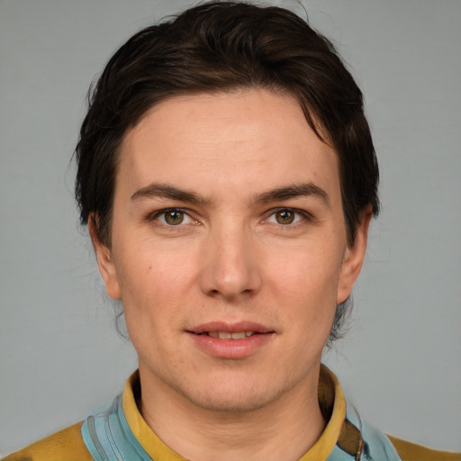 Joyful white young-adult male with short  brown hair and brown eyes