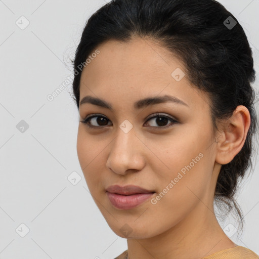 Joyful latino young-adult female with medium  brown hair and brown eyes