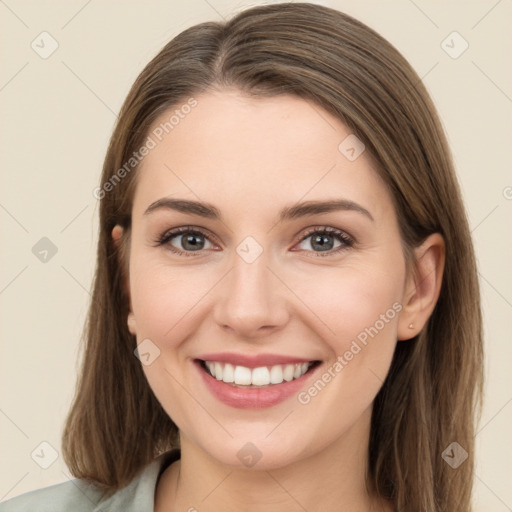 Joyful white young-adult female with long  brown hair and grey eyes