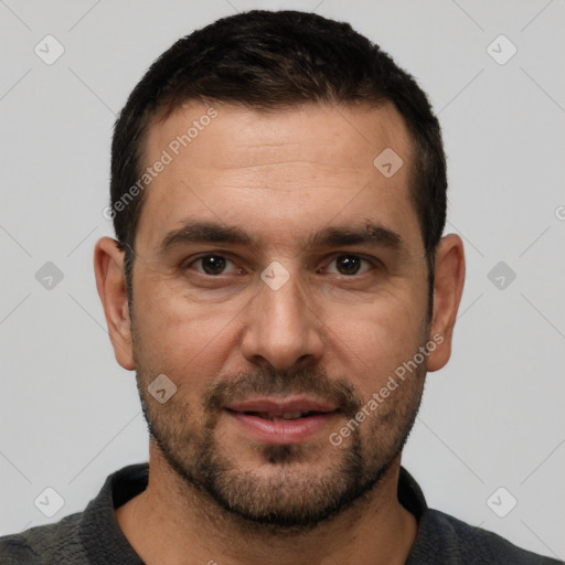 Joyful white young-adult male with short  black hair and brown eyes