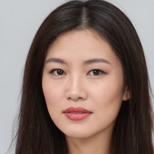 Neutral asian young-adult female with long  brown hair and brown eyes