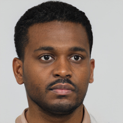 Neutral black young-adult male with short  brown hair and brown eyes