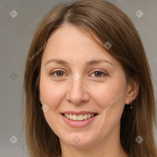 Joyful white adult female with medium  brown hair and brown eyes