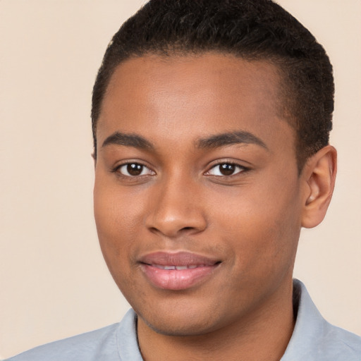 Joyful black young-adult male with short  brown hair and brown eyes